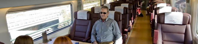 Passengers relax in a first class carriage aboard a France-Spain high speed TGV